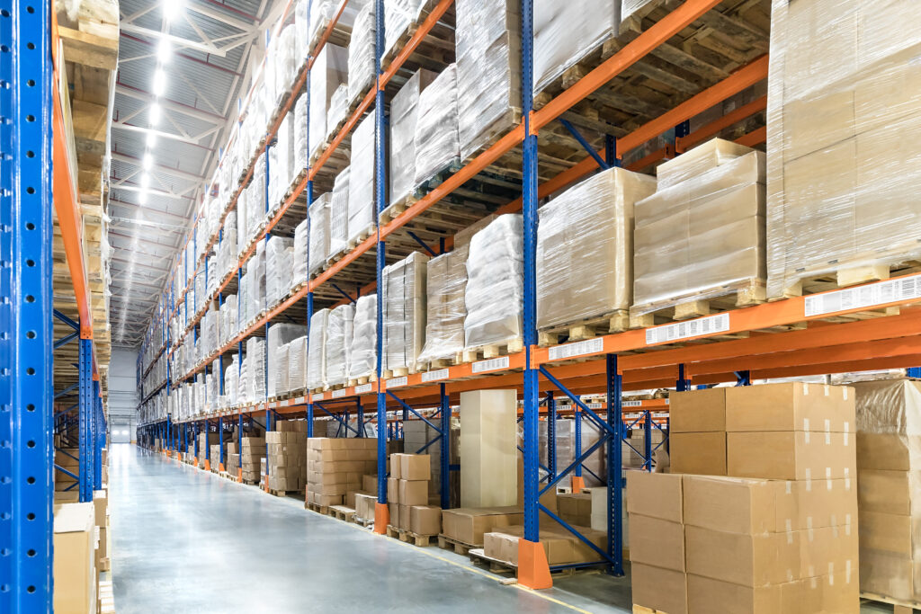 Huge distribution warehouse with high shelves. Bottom view.